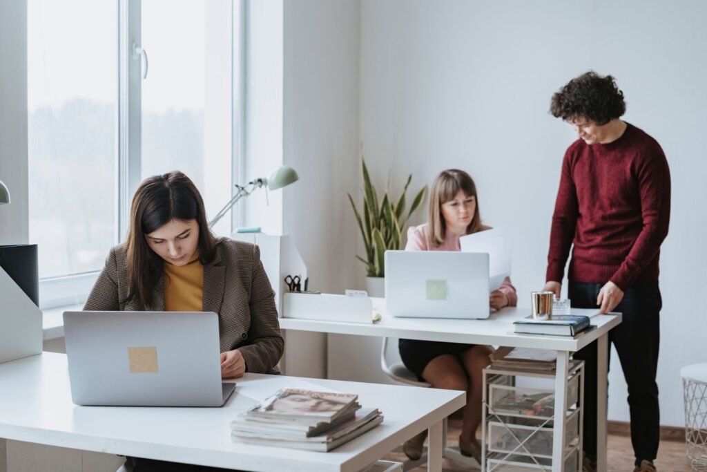 b2b tech - business team with laptops in office
