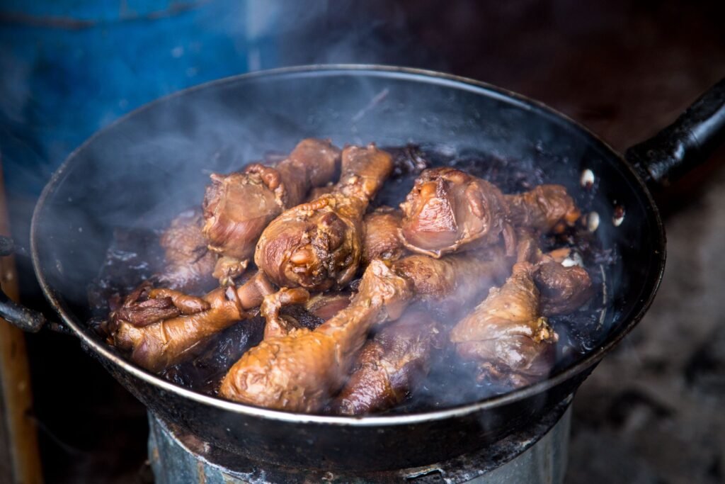 How to cook chicken: drumsticks searing in a hot pan